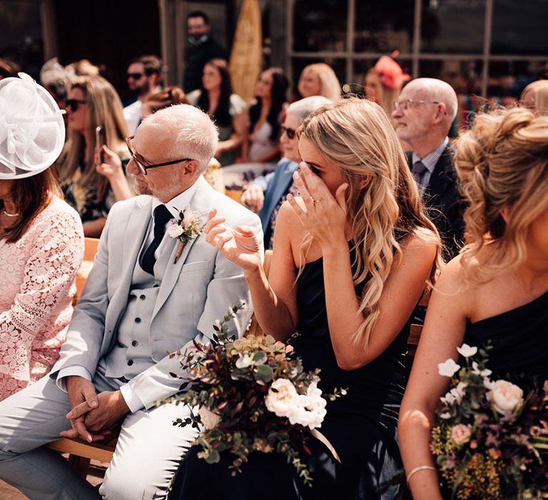 Bridesmaids get emotional during wedding ceremony