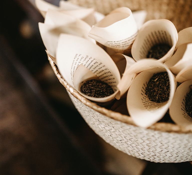 Paper cones filled with dark coloured confetti