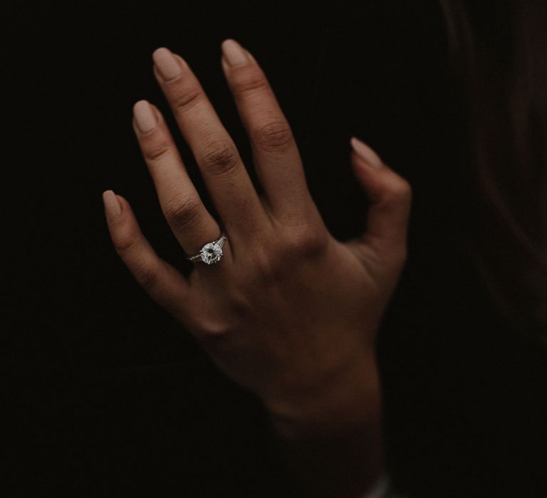 Bride wears neutral nail polish whilst showing off her diamond engagement ring | James Frost Photography