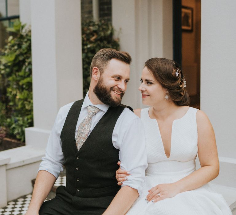 Bride and groom share a tender moment at Norwich wedding venue