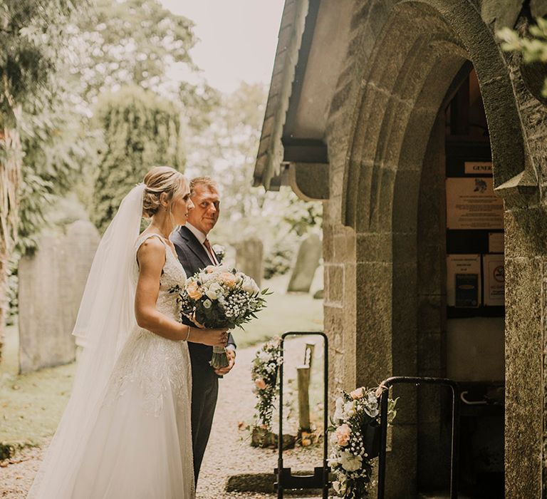 Bride awaits to go into church wedding ceremony