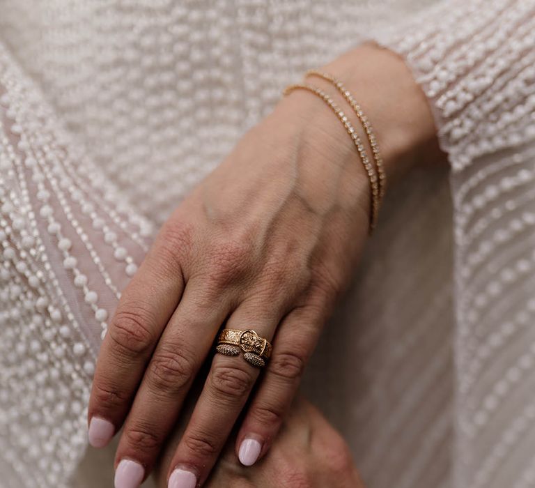 pink wedding day nails and gold signet rings 