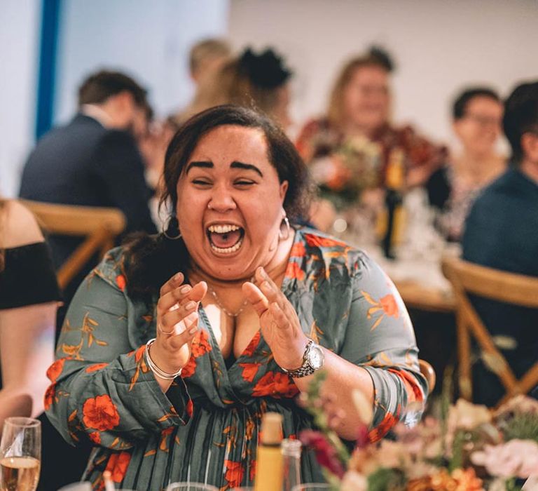 Wedding guest enjoys wedding speeches