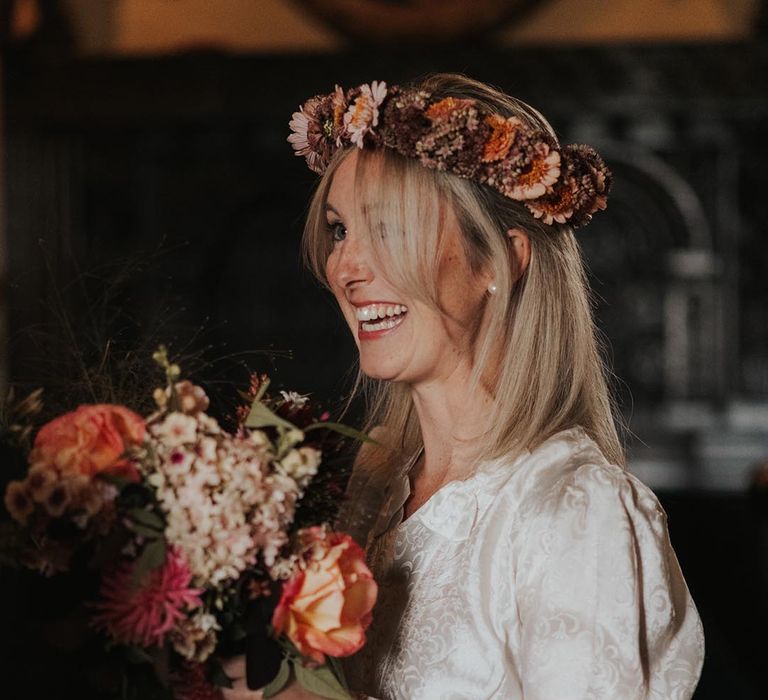 Bride in second-hand wedding dress with flower crown