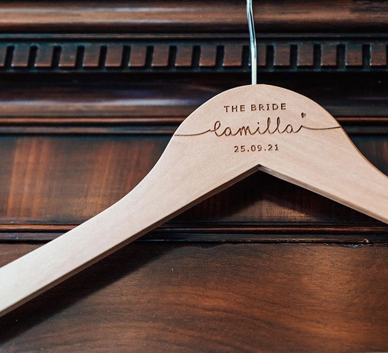 Personalised coat hanger with bride's name and wedding date on