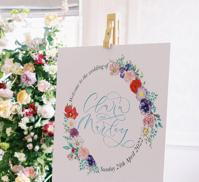 colourful wedding welcome sign with flower motif 