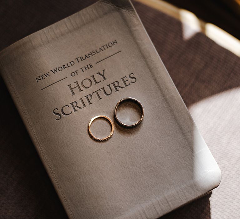 White bible with two wedding bands for Burley Manor wedding