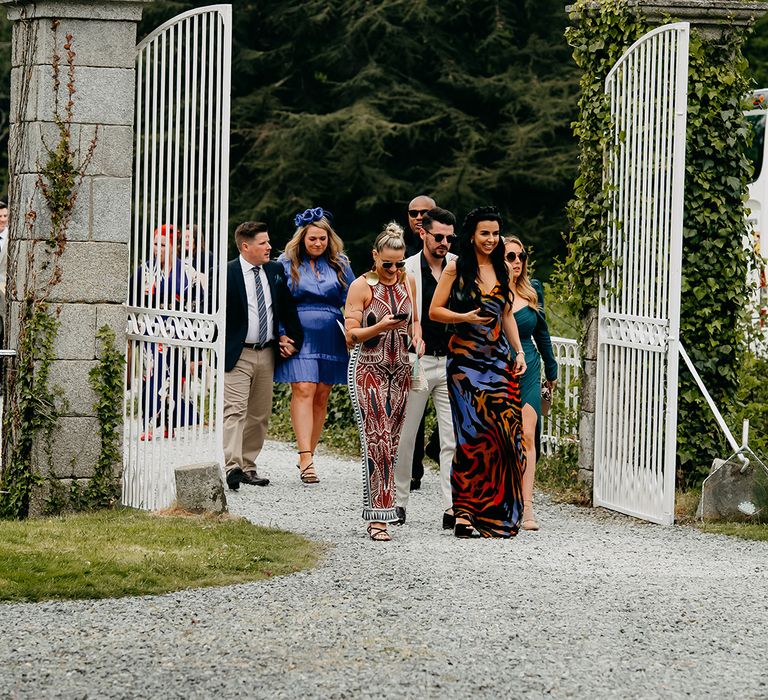 Wedding guests turn up to the chateau for the wedding 