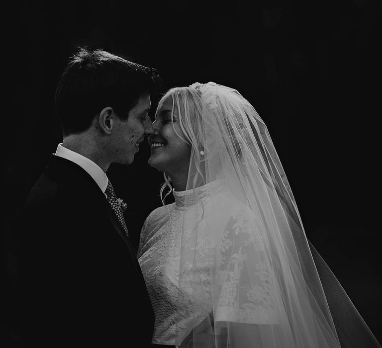 Groom leans in to kiss the bride 