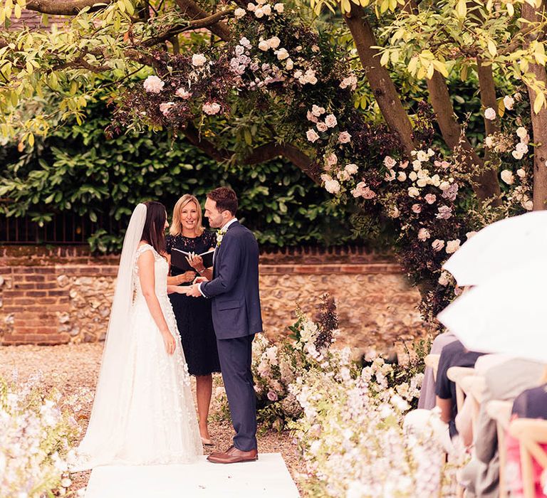 Bride and groom stand at the altar for their outdoor civil wedding ceremony 