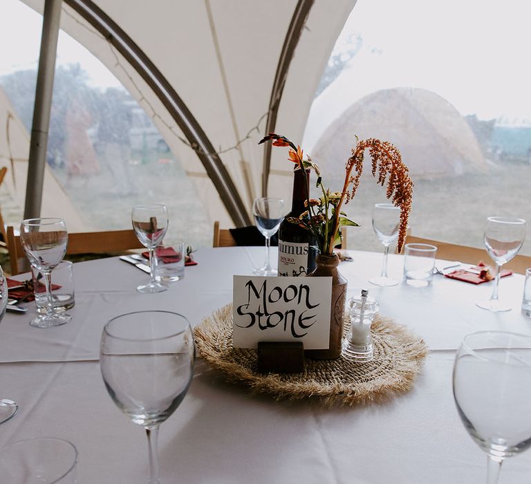 Marquee wedding reception complete with DIY table name signage and dried floral arrangements 