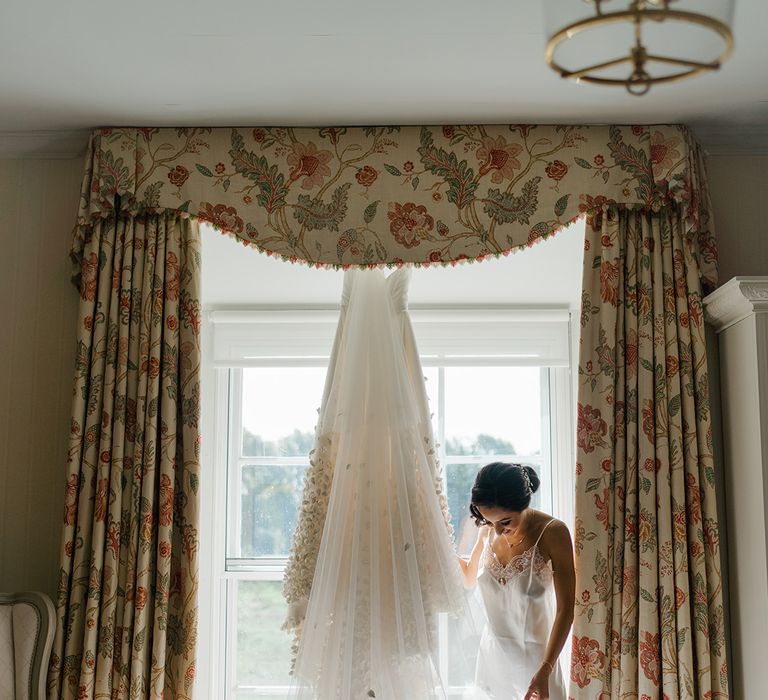 Emma Beaumont design wedding dress with floral embellished Princess skirt and cathedral styled veil 