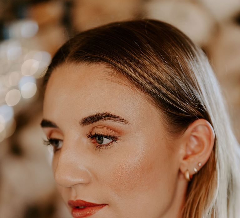 Bride with natural and glowy wedding makeup and short blonde hair 