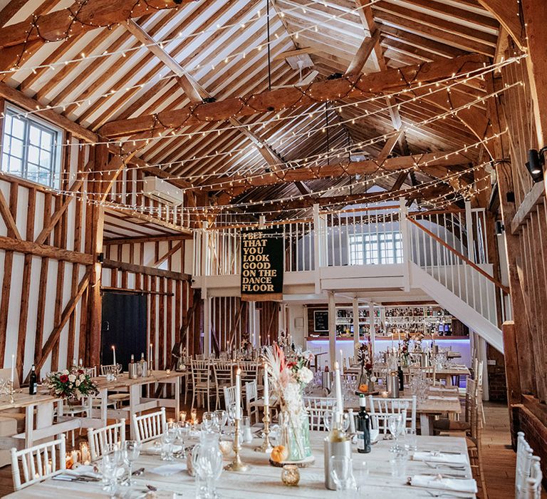 Rustic Milling Barn wedding venue in Hertfordshire with fairy lights and wedding banner decor 