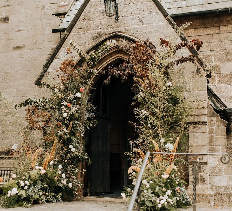 Autumnal rustic church wedding flower column entrance decorations 