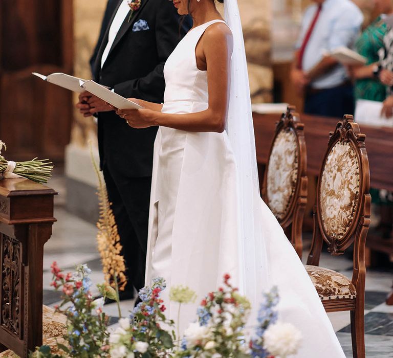 Church wedding ceremony in Sicily with bride and groom exchanging vows 