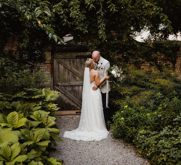 Bride in Alexandra Grecco wedding dress with the groom for their wedding in North Yorkshire