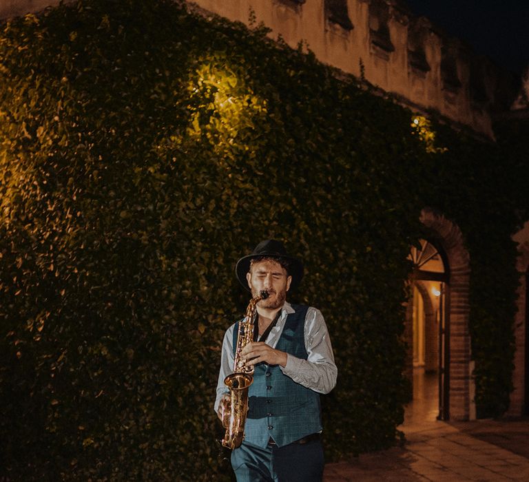 Live wedding music - musician playing the saxophone at destination wedding 