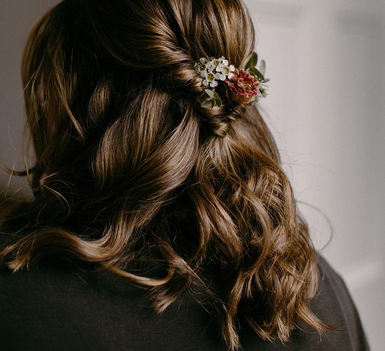 Simple half up half down wedding hair with pretty wax flower hair accessories 