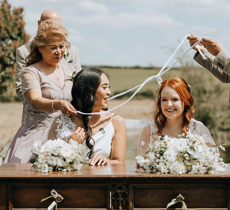 Unique Filipino unity veil and cord wedding ceremony tradition to acknowledge one of the bride's heritage 