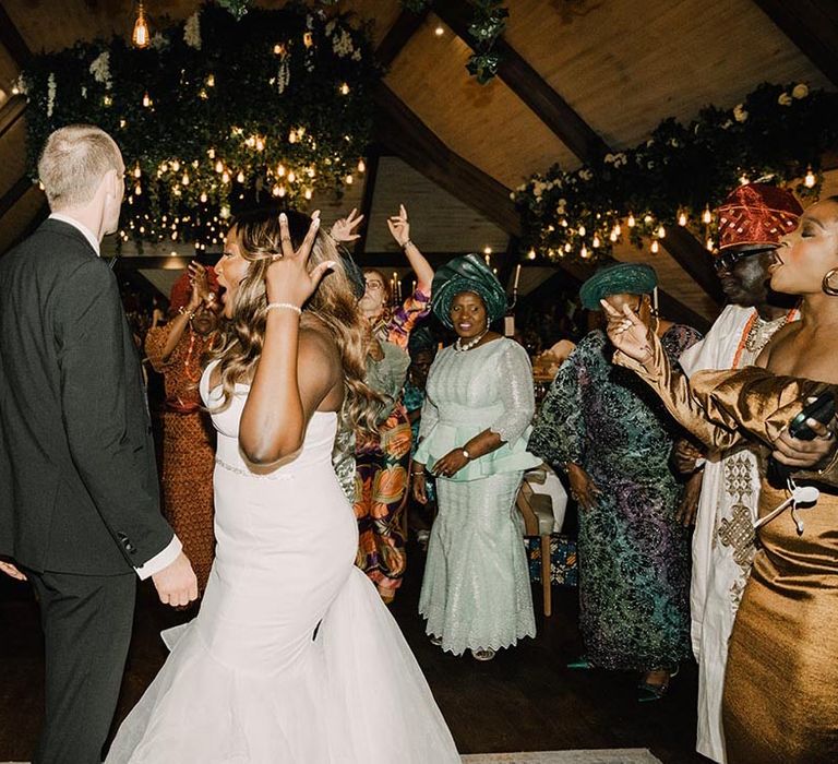 Wedding reception at Northern Ireland wedding with the bride and groom dancing together at barn wedding 