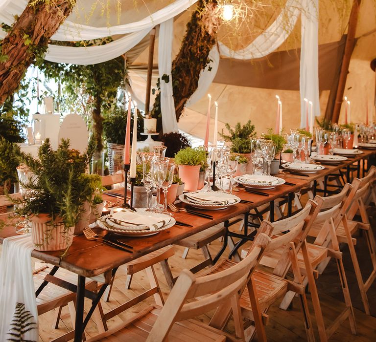 The Garden Tipi wedding with white drapery and foliage for eco-friendly wedding decor 