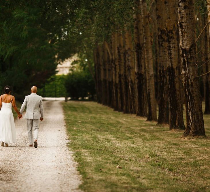 Bride and groom take a walk at Bordeaux wedding venue