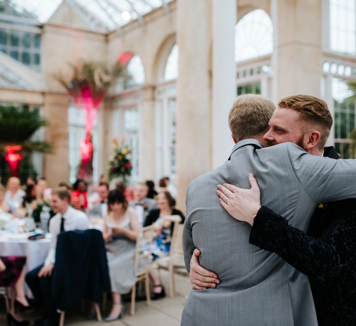 Groom embracing his best man after the speeches