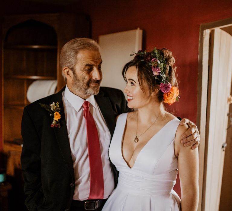 Father of the bride and daughter on wedding morning 