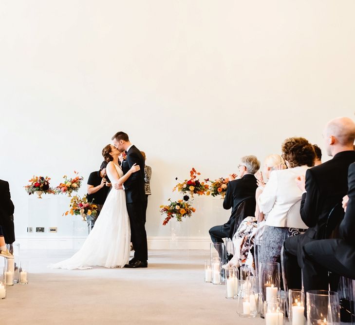 Bride and groom kissing at Carlton House Terrace civil wedding ceremony 