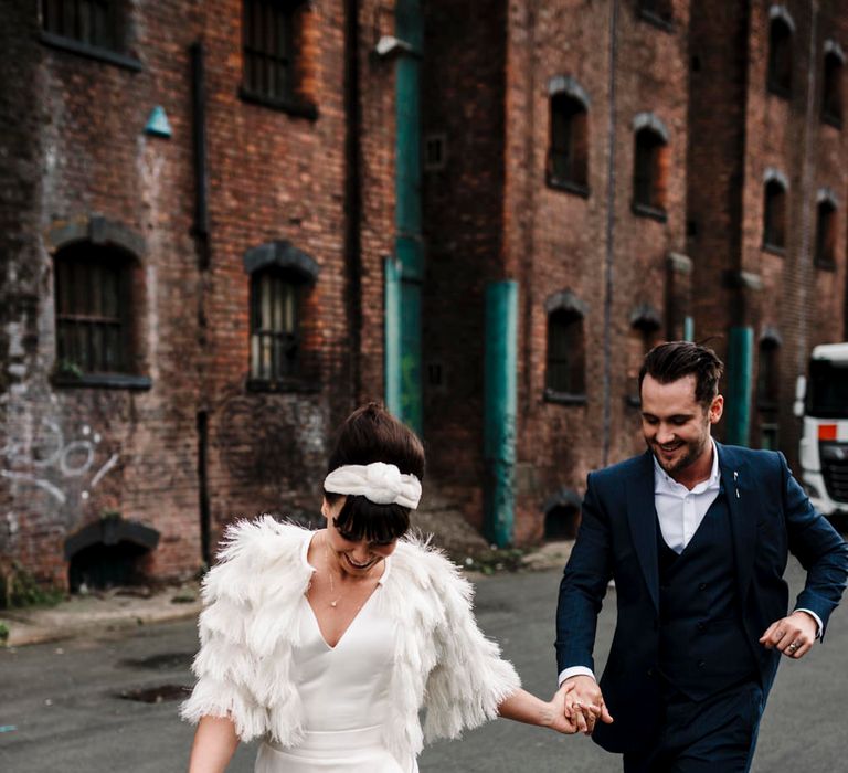 Bride and groom dancing in the streets in Liverpool 