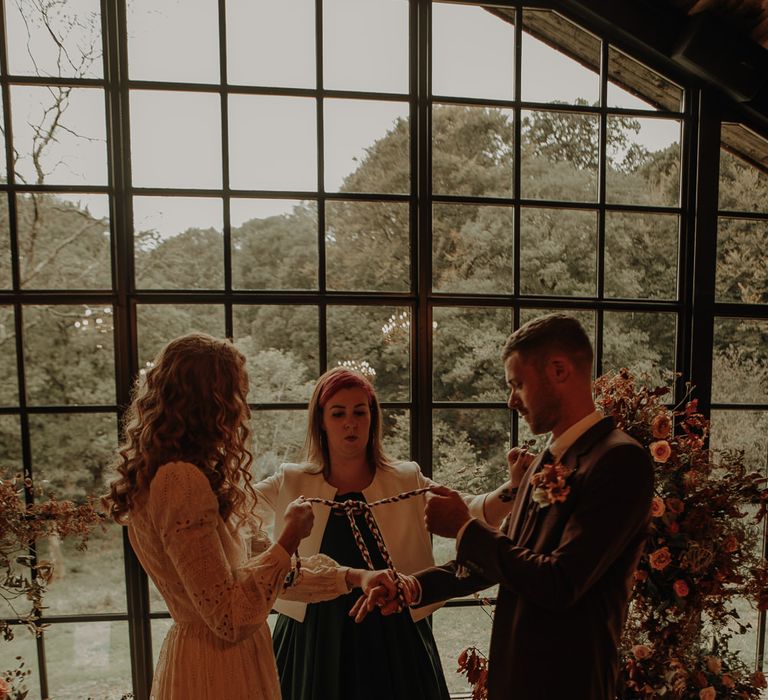 Hand fastening ceremony at The Hidden River Cabins 