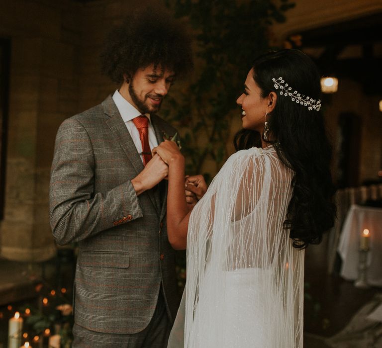 Bride wearing a hair vine and bridal cape 