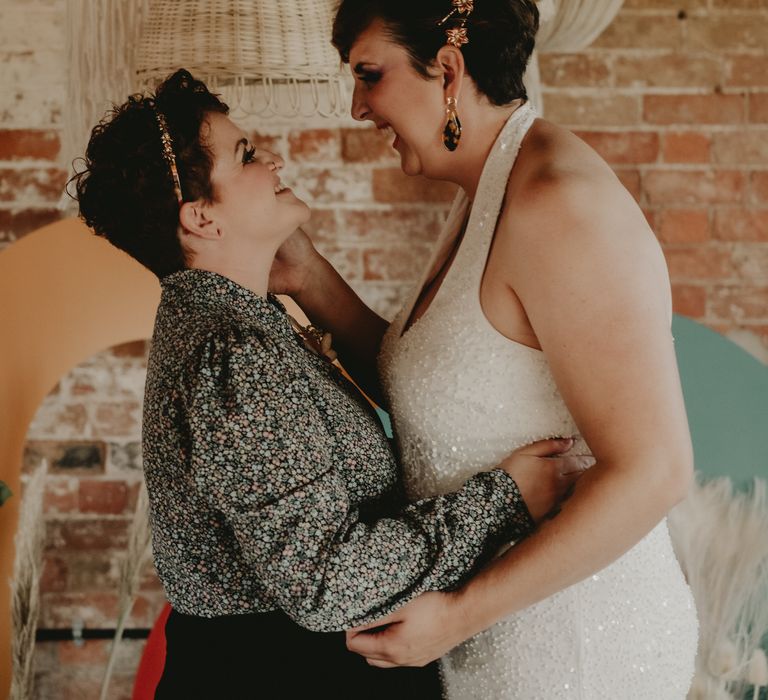 Intimate wedding portrait of two brides at LGBT wedding 