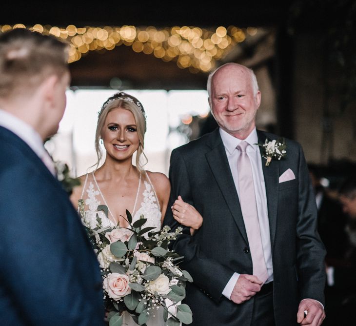 Cotswold barn wedding in spring with pink roses 