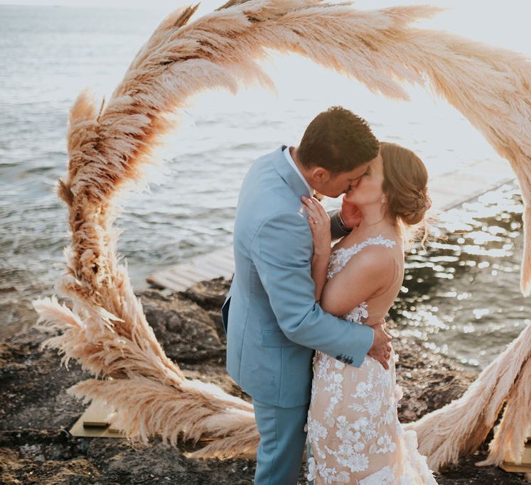 Pampas grass moon gate at coastal wedding