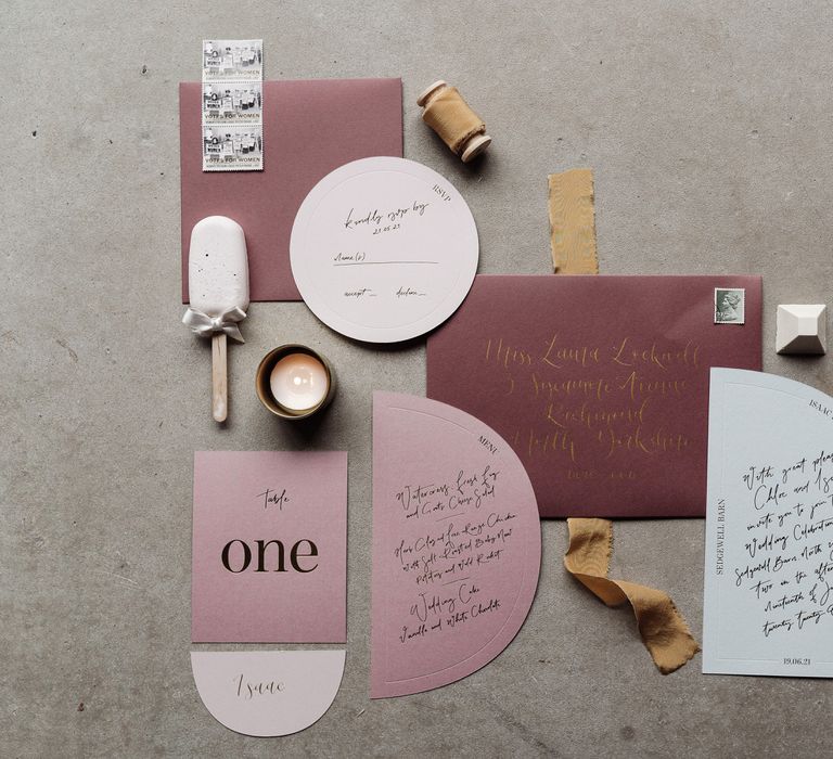 Soft romantic wedding stationery in pink, gold and pastel tones