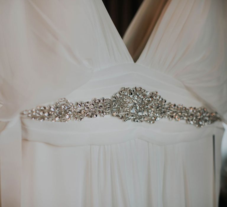 Silver gem detailing on white wedding dress