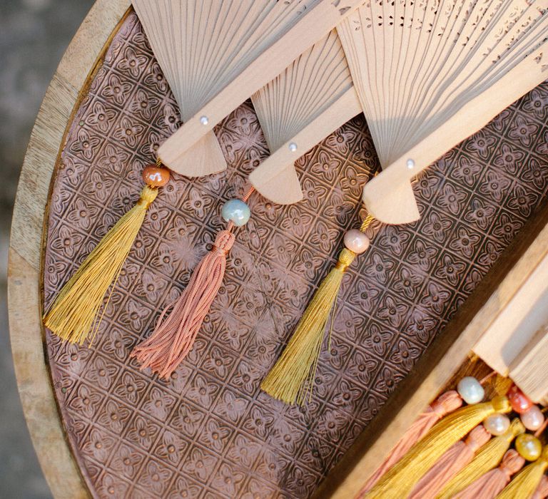 Wooden fans for guests to help themselves to