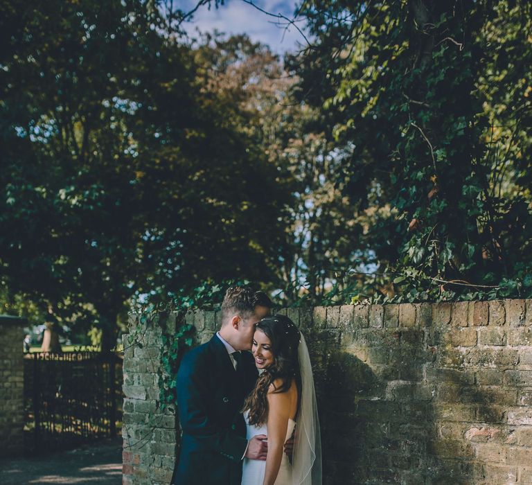 Bride and groom holding each other on their wedding day in London