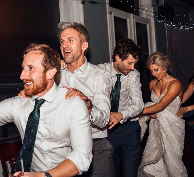 Conga line during wedding reception