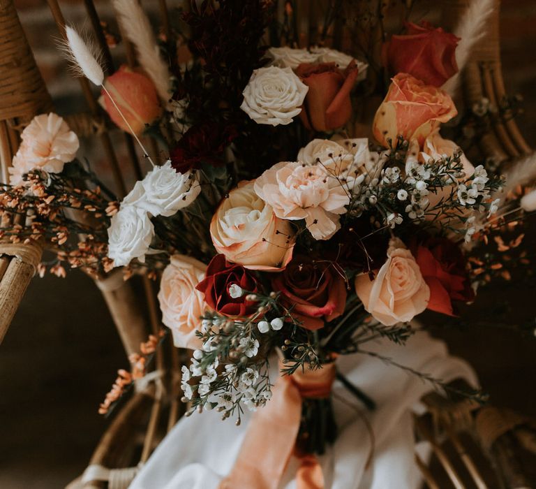 Large bouquet of mixed roses with pink silk ribbon