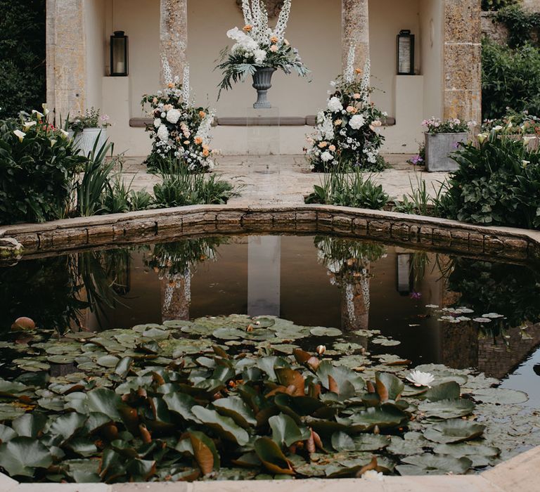 Gardens at Barnsley House luxury wedding venue with white and peach wedding flowers 