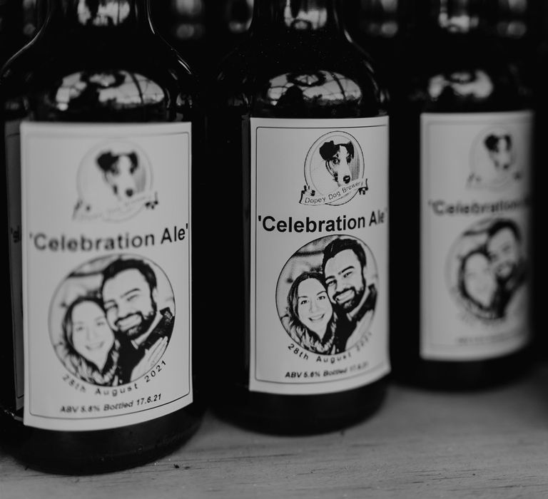 Four bottles of personalised ale reading 'Celebration Ale' for outdoor wedding in Bedfordshire