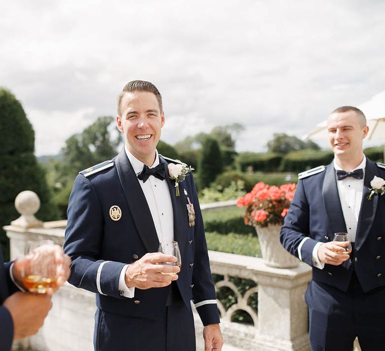 Groom wears Military Uniform and floral buttonhole on wedding day