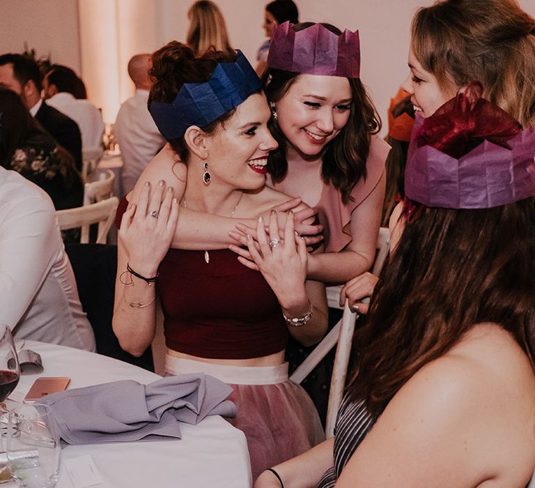 Wedding guests wear Christmas hats on wedding day