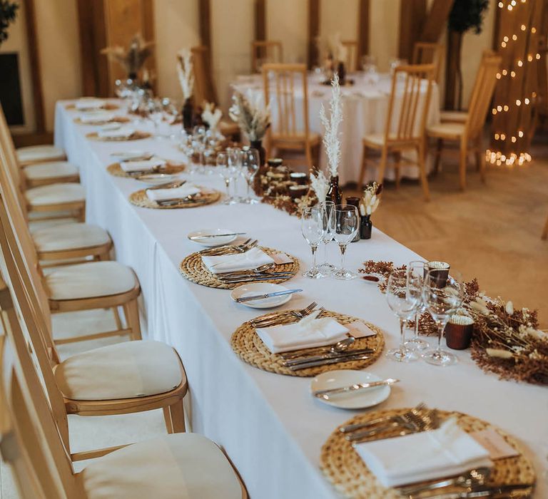 Neutral wedding decor with dried flower table decorations