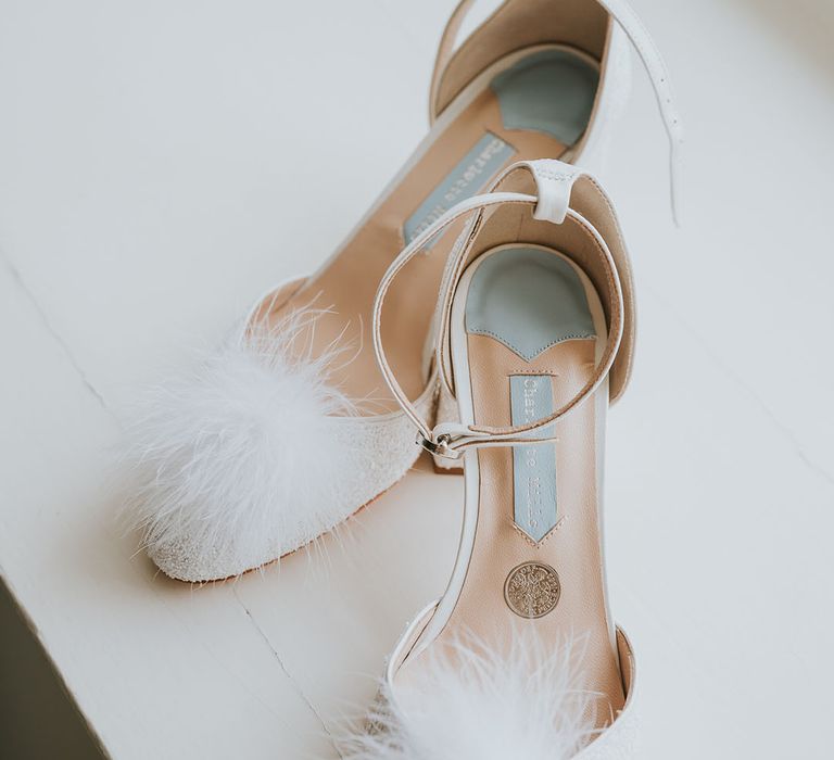 Charlotte Mills wedding shoes with fluffy details and silver sixpence in their shoe 