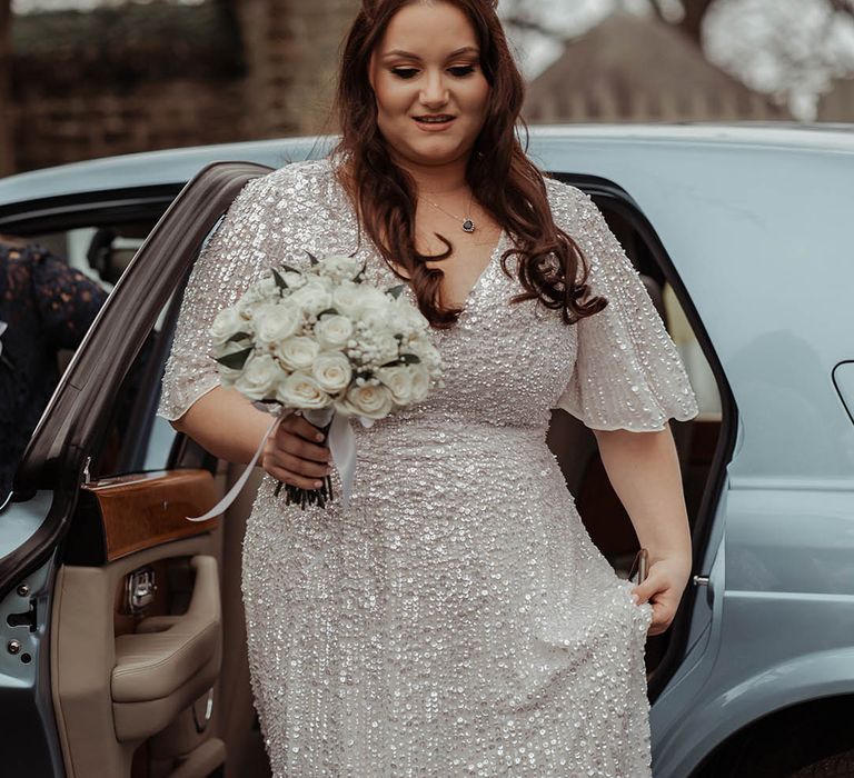 Bride leaves car wearing glittery ASOS wedding gown