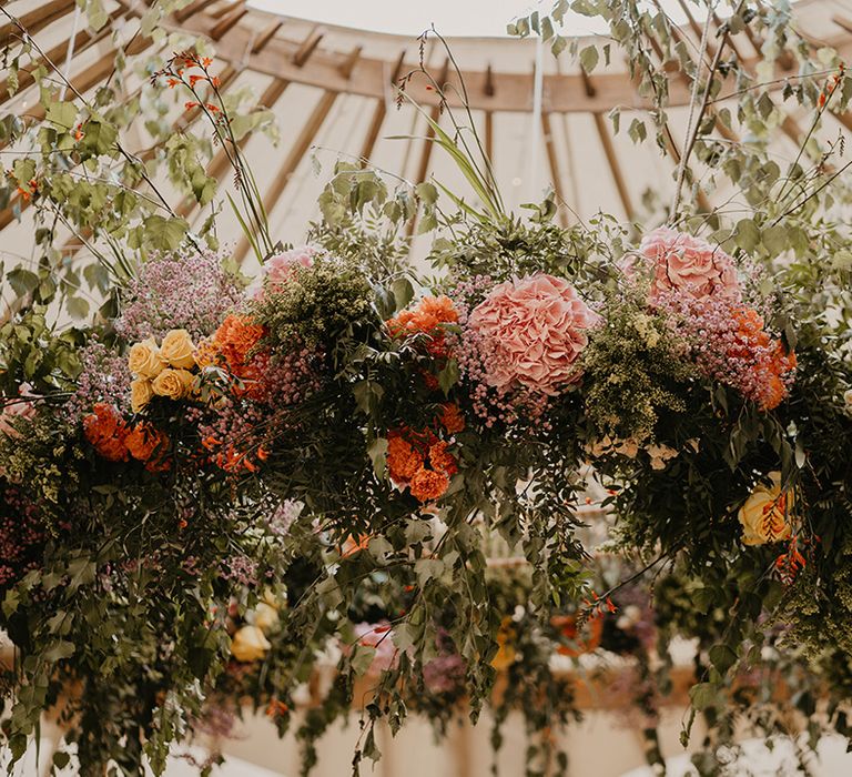 Gorgeous large floral display at wedding with colourful flowers